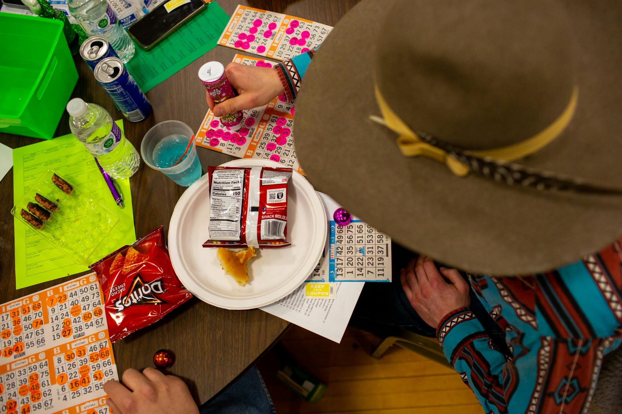 Cooper Ernst fills out his bingo card during Designer Purse & Gun Bingo.