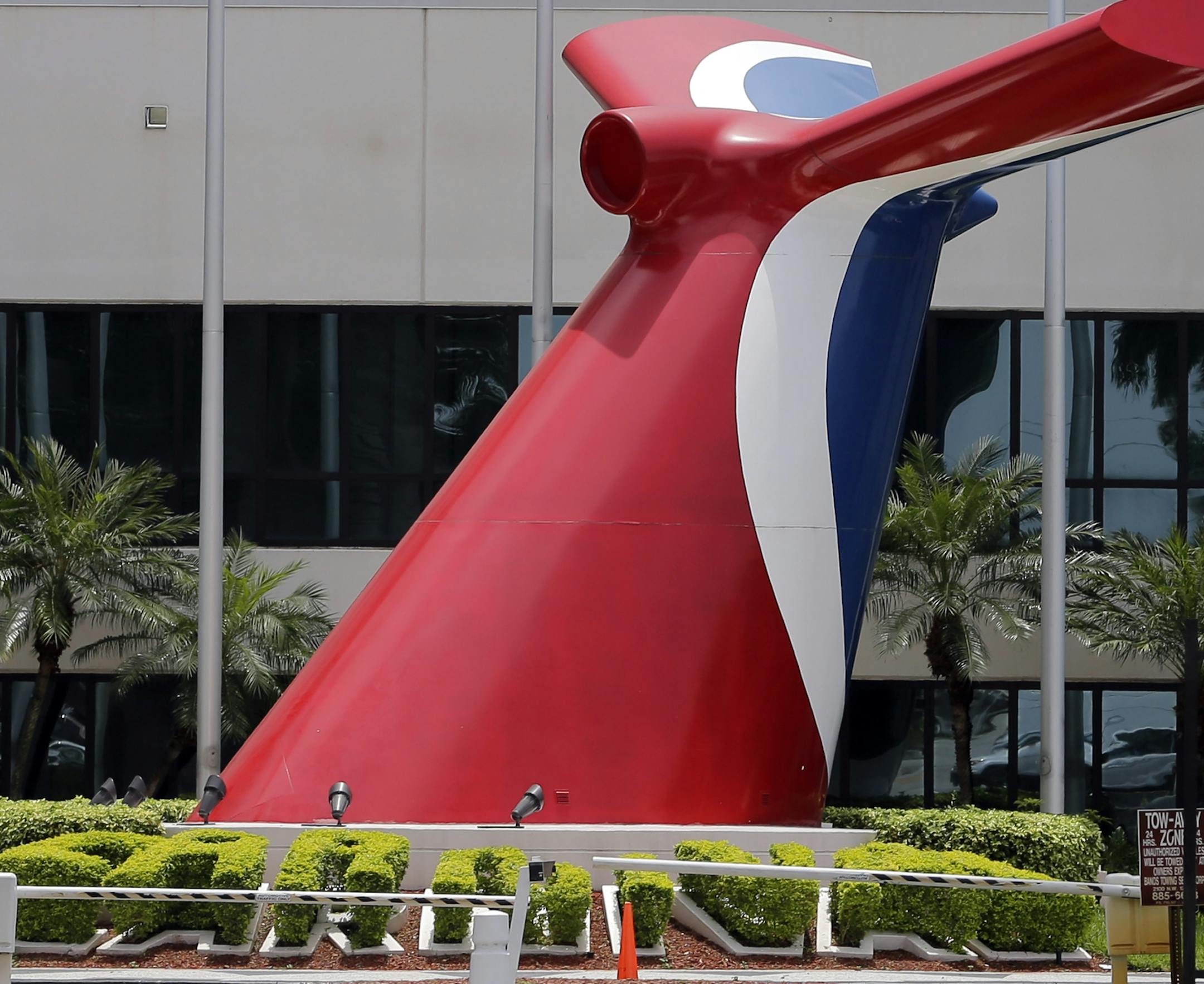 Carnival Cruise Lines main entrance of their office building is shown, Tuesday, July 7, 2015, in Miami. Starting in May, Carnival Corp. plans to offer trips from Miami to Cuba, the company announced Tuesday. Carnival says it would become the first American cruise company to visit the Caribbean island nation since the 1960 trade embargo. (AP Photo/Alan Diaz)