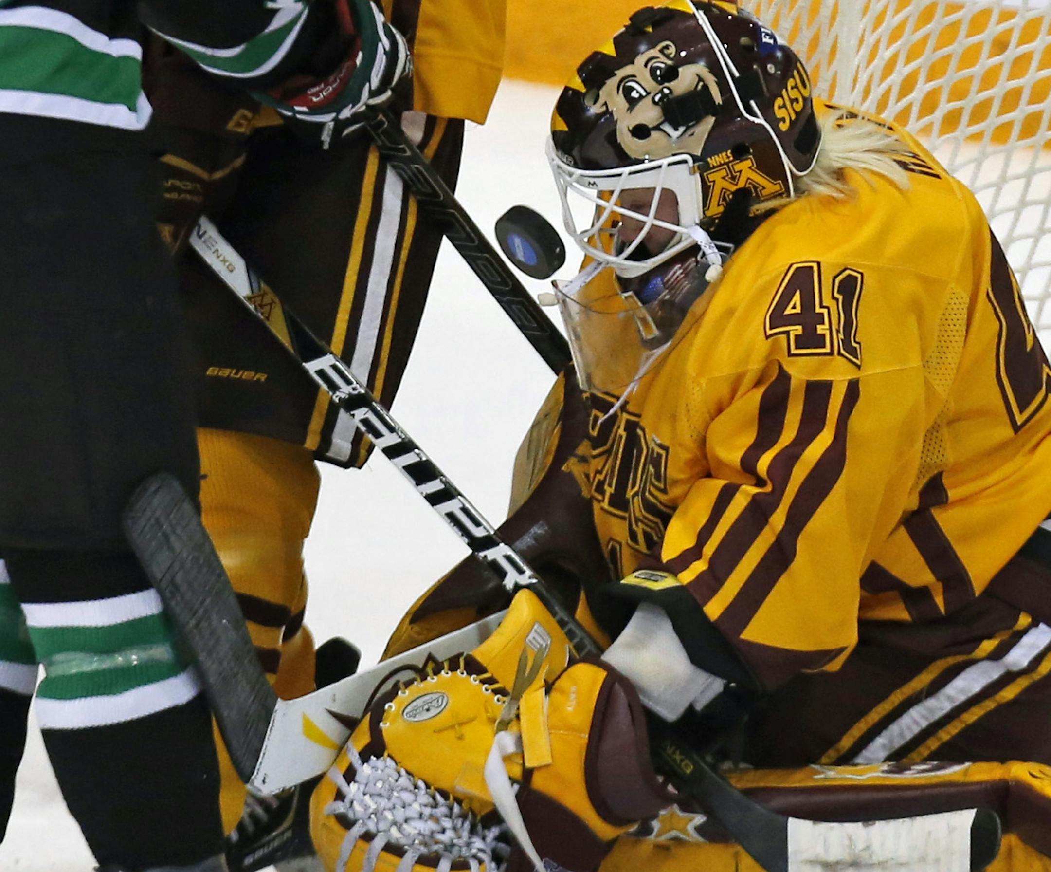 Minnesota goalie Noora Raty stops a North Dakota shot on goal during a college hockey game between Minnesota and North Dakota, Saturday, March 16, 2013, in Minneapolis. (AP Photo/The Star Tribune, Bruce Bisping) ORG XMIT: MIN2013032116454301