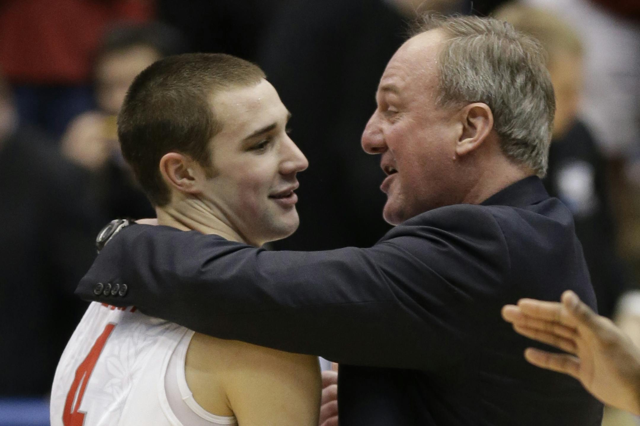 Ohio State head coach Thad Matta, right, hugs guard Aaron Craft (4) after they defeated Iowa State 78-75 in a third-round game of the NCAA college basketball tournament on Sunday, March 24, 2013, in Dayton, Ohio. Craft hit the game-winning three-point basket. (AP Photo/Al Behrman)