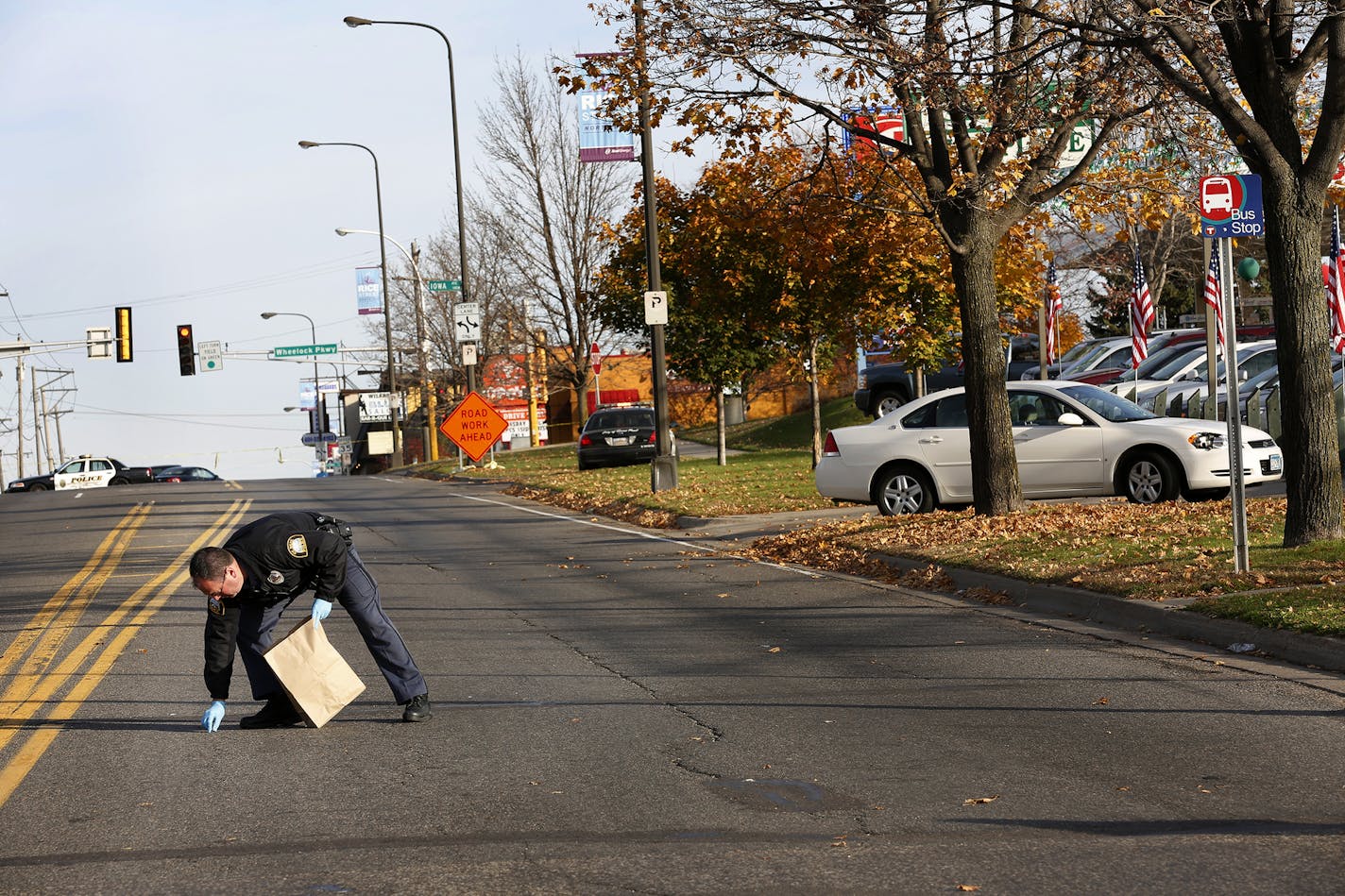 St. Paul Police investigate the scene of an accident involving the white car at right, thath hit a 12-year-old boy crossing the street around 7am this morning at the intersection of Rice Street and Hoyt Avenue in St. Paul. The boy is in critical condition with severe head injuries at Regents Hospital. ] LEILA NAVIDI leila.navidi@startribune.com /