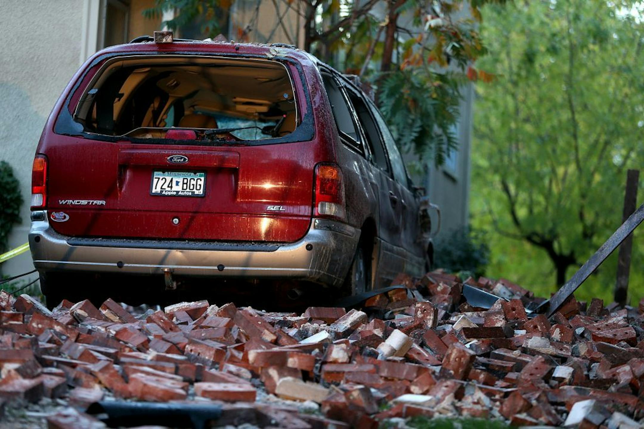 A pile of bricks and a damaged vehicle told the story of the collapse of a facade on a Minneapolis apartment building early Friday.