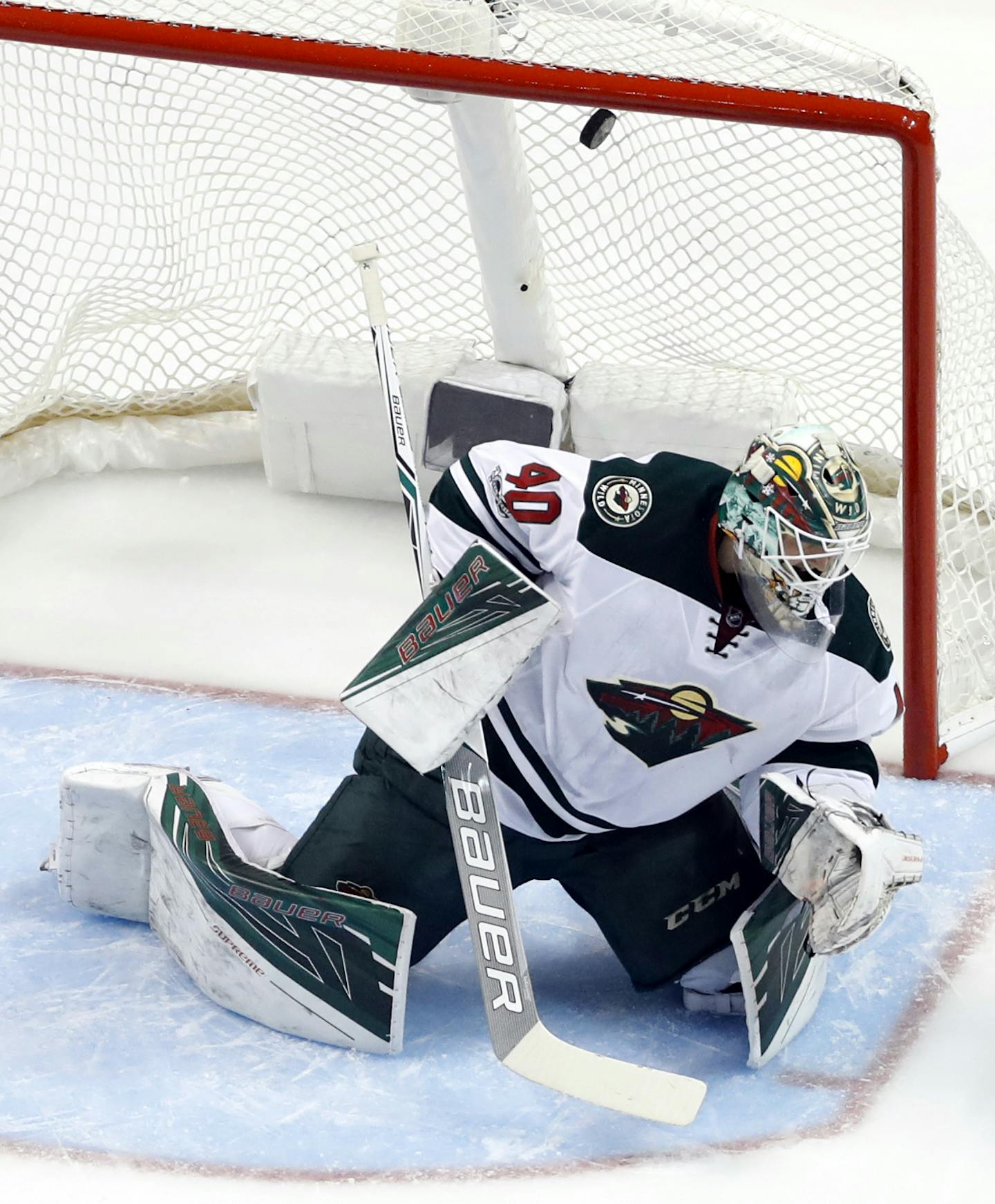 A shot by St. Louis Blues' Colton Parayko sails over the head of Minnesota Wild goalie Devan Dubnyk for a goal during the first period in Game 3 of an NHL hockey first-round playoff series Sunday, April 16, 2017, in St. Louis. (AP Photo/Jeff Roberson)