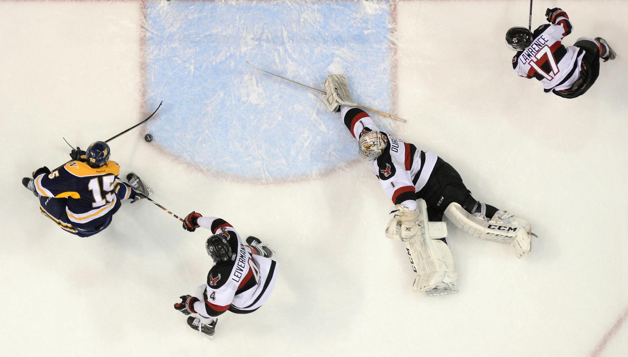 Wayzata forward Amar Batra (15) nearly scored on Eden Prairie goalie Shaun Durocher (1) but was stopped by defenseman Nicky Leivermann (4) on the back side in the first period. ] (AARON LAVINSKY/STAR TRIBUNE) aaron.lavinsky@startribune.com Eden Prairie played Wayzata in the Class 2A boys' hockey championship game on Saturday, March 5, 2016 at Xcel Energy Center in St. Paul, Minn.