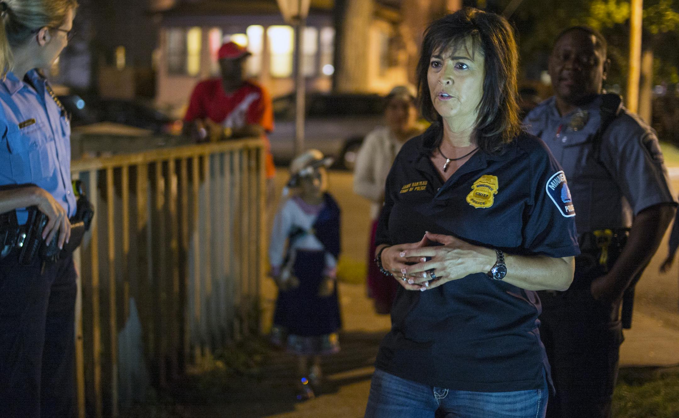 In the neighborhood of a double homicide that arose out of domestic violence on the 2200 block of 10th Avenue S. in September, Minneapolis Police Chief Janee Harteau talked with neighbors to assure them that their safety was not at risk.