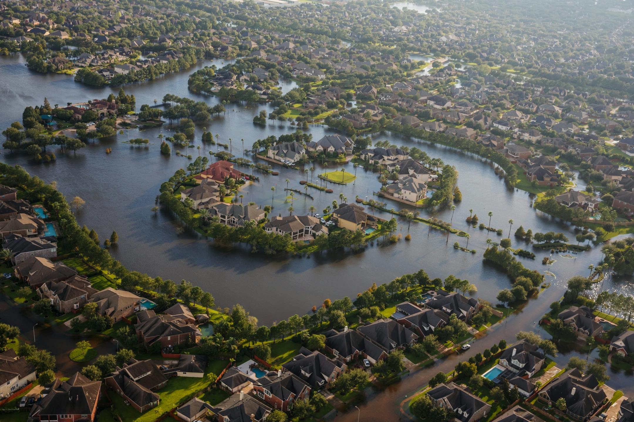 Flood water surround homes in a residential neighborhood in the wake of Hurricane Harvey in Houston, on Tuesday, Aug. 29, 2017.