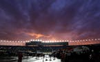 Skies start to clear during a rain delay in the Sprint Cup Series auto race at Kansas Speedway in Kansas City, Kan., Saturday, May 9, 2015. (AP Photo/