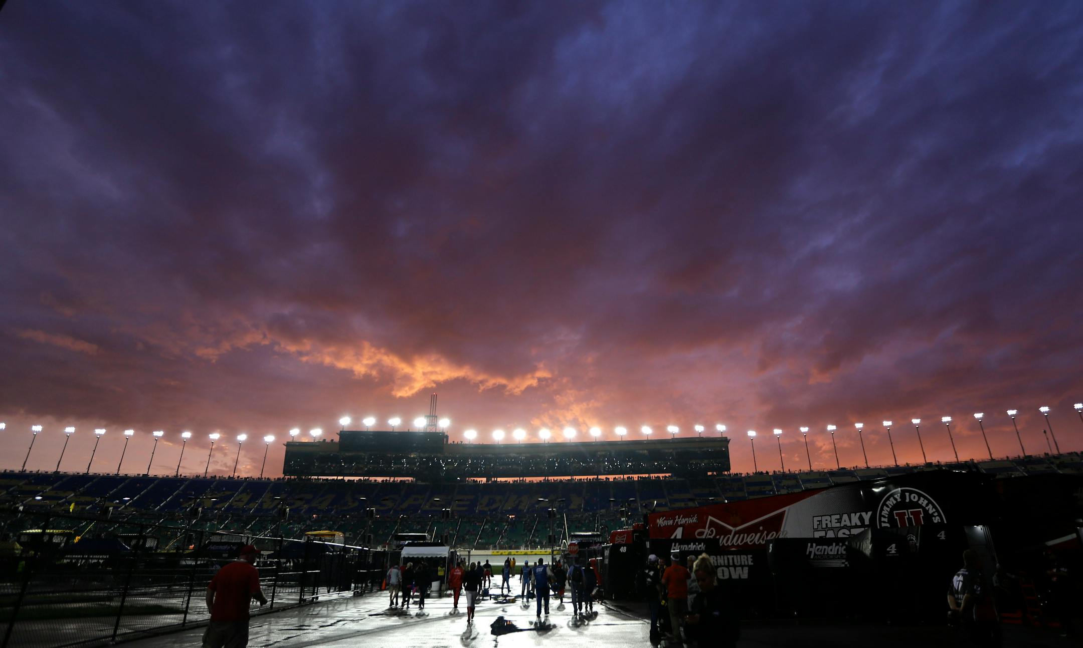 Skies start to clear during a rain delay in the Sprint Cup Series auto race at Kansas Speedway in Kansas City, Kan., Saturday, May 9, 2015. (AP Photo/Orlin Wagner)