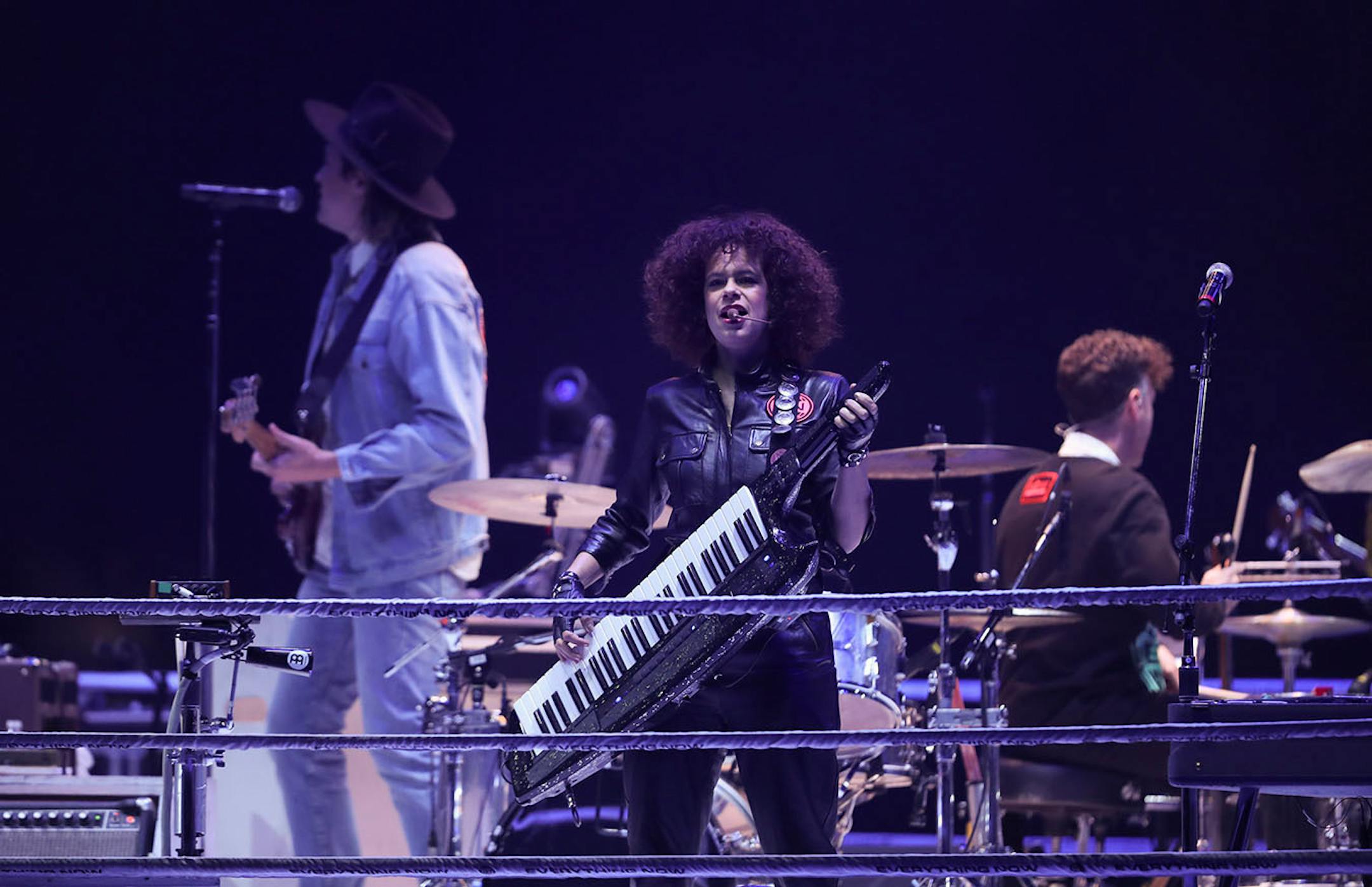 Keyboardist Regine Chassagne with Win Butler and drummer Jeremy Gara early in Arcade Fire's set.