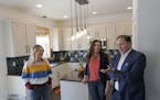The DeRushas' worked with Morgan Molitor, left, construction2style, to create their new kitchen.
