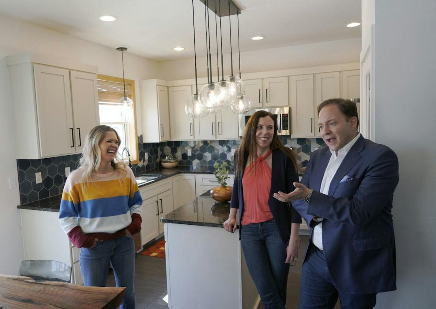 The DeRushas' worked with Morgan Molitor, left, construction2style, to create their new kitchen.