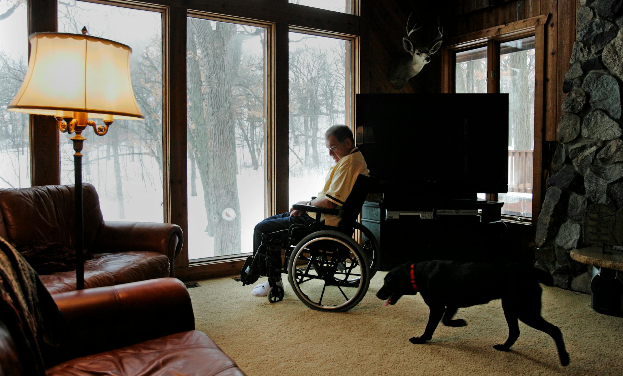 Former Minnesota Vikings linebacker Wally Hilgenberg battles with ALS off the field these days, which has taken much of Hilgenberg's mobility but done little to diminish his spirit. Hilgenberg is seen at the family's Prior Lake home with his beloved black lab, Ruby.