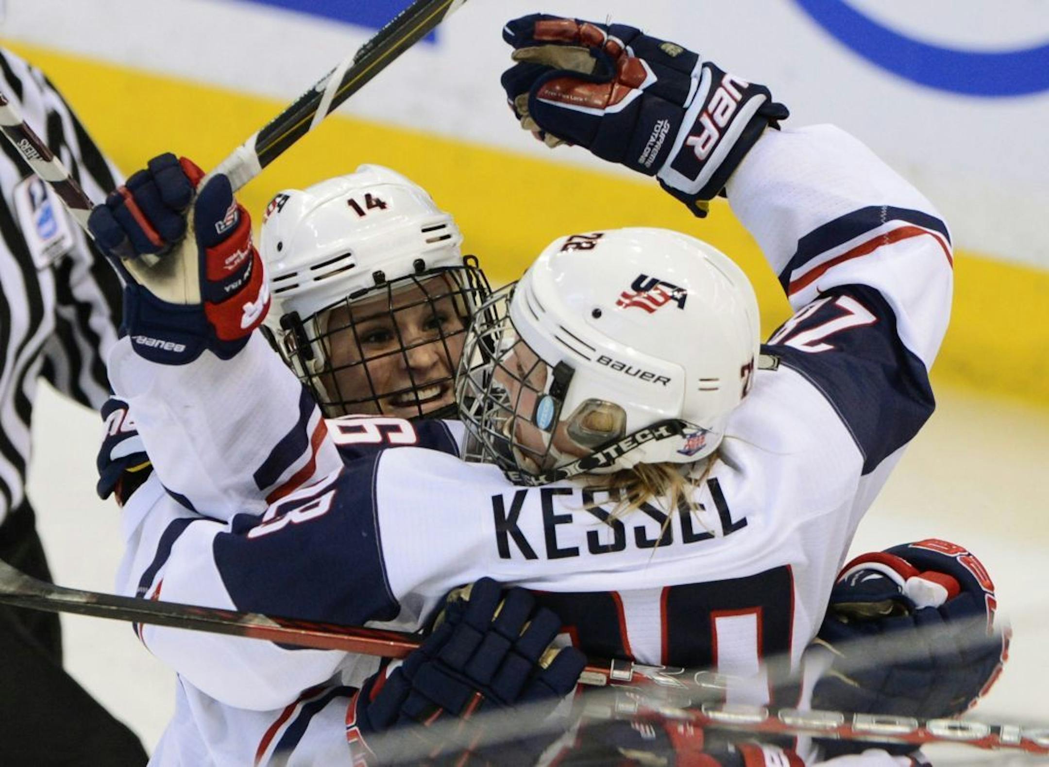 United States' Brianna Decker races to congratulate Amanda Kessel on her third-period goal against Canada in the gold-medal game at the women's world hockey championships in Ottawa, Ontario, Tuesday, April 9, 2013.