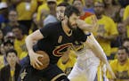 Cleveland Cavaliers forward Kevin Love (0) is defended by Golden State Warriors guard Klay Thompson (11) during the first half of Game 7 of basketball