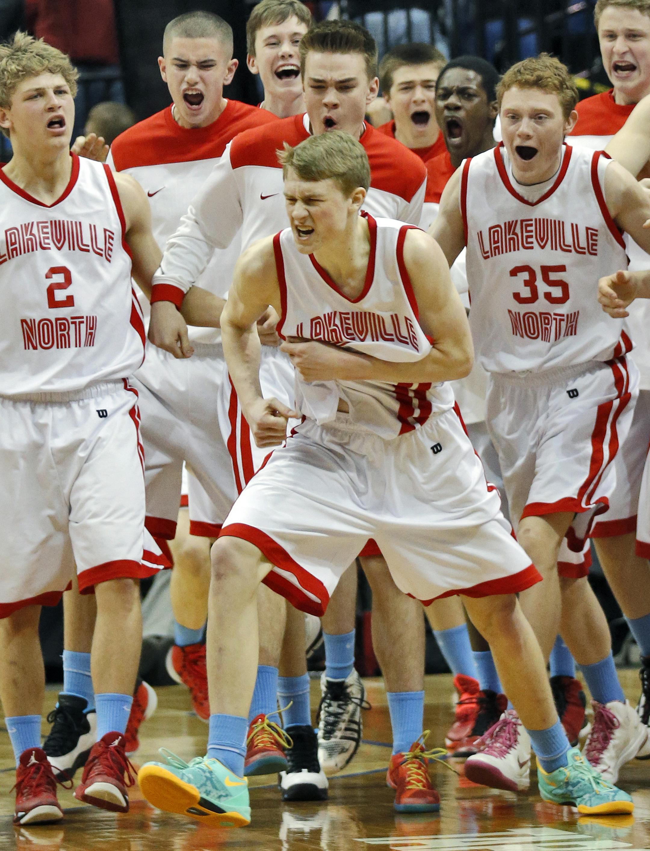 Panthers J. P. Macura hit a three-point shot with time running out in regulatiion play, then celebrated with teammates, center. Final score Lakeville North 55 - Cretin-Derham Hall 52. ] Class 4A Boys Basketball Tournament. Lakeville North Panthers vs. Cretin Derham Hall Raiders.(MARLIN LEVISON/STARTRIBUNE(mlevison@startribune.com)