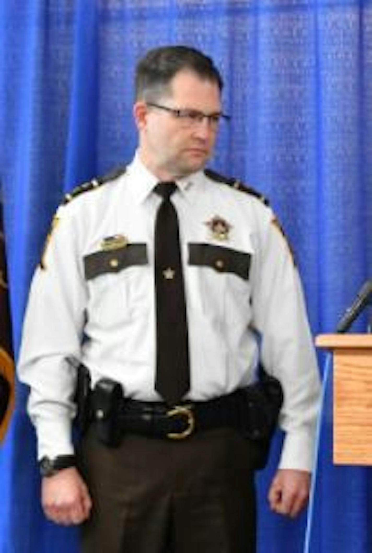 Interim Ramsey County Sheriff Jack Serier looks on at a 2016 news conference where his predecessor Matt Bostrom announced his retirement.