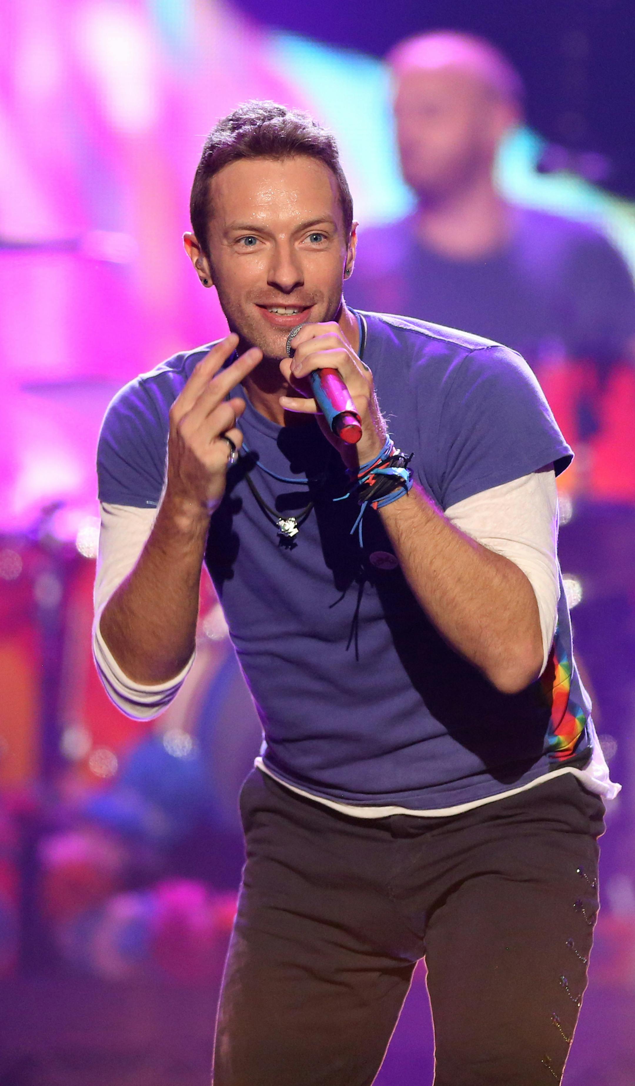 FILE - In this Sunday, Nov. 22, 2015 file photo, Chris Martin of Coldplay performs at the American Music Awards at the Microsoft Theater, in Los Angeles. Coldplay will perform at the Pepsi Super Bowl 50 Halftime Show on CBS Sunday, Feb. 7, 2016, the NFL announced on Thursday, Dec. 3, 2015. (Photo by Matt Sayles/Invision/AP, File)