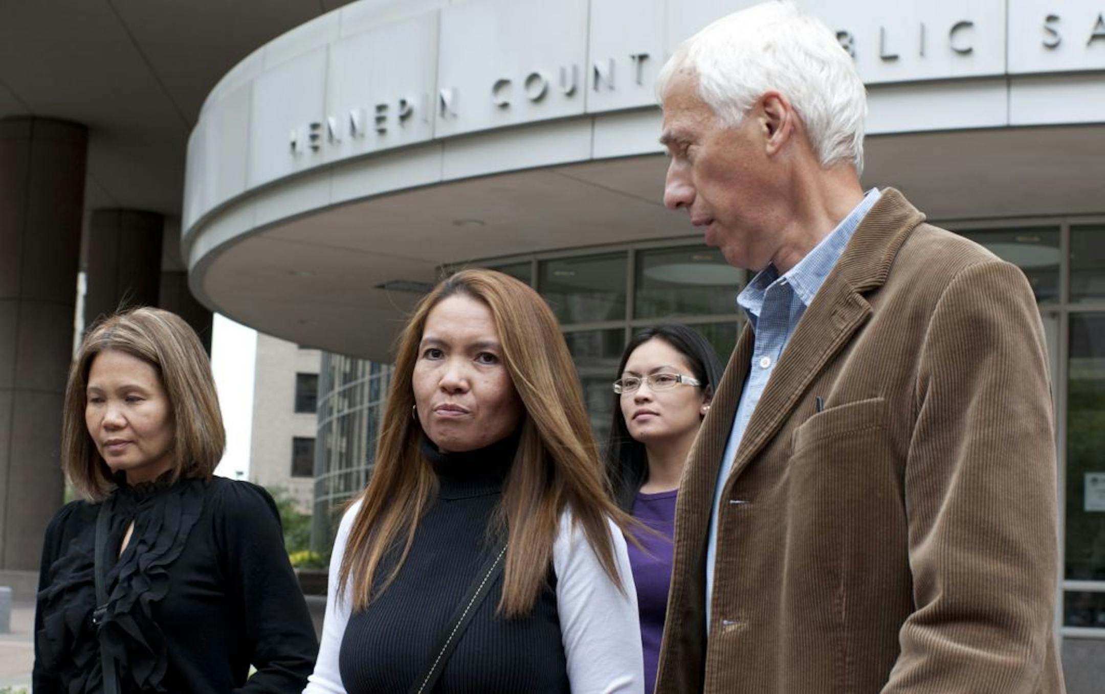 Vilayphone Phanthacong, center, sister of Anousone "Ped" Phanthavong and other family members of victim left court Friday after Amy Senser made an appearance there today at the Hennepin County Public Safety building.