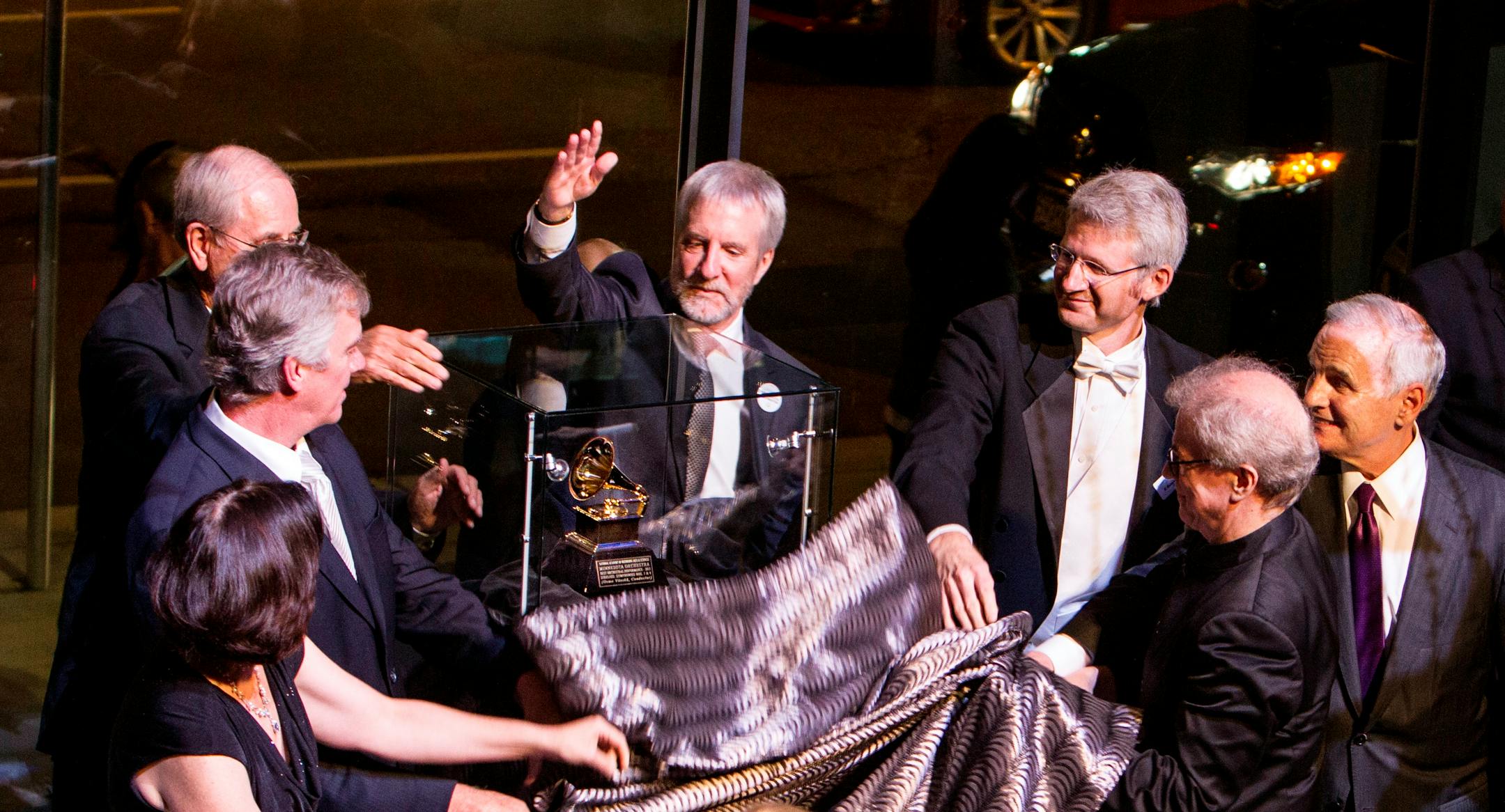 The Minnesota Orchestra unveiled its Grammy Award in September with a group that included (clockwise from lower left) Minneapolis Mayor Betsy Hodges, St. Paul Mayor Chris Coleman, orchestra board chair Gordon Sprenger, president Kevin Smith, principal trombone Doug Wright, Gov. Mark Dayton and music director Osmo Vanska.