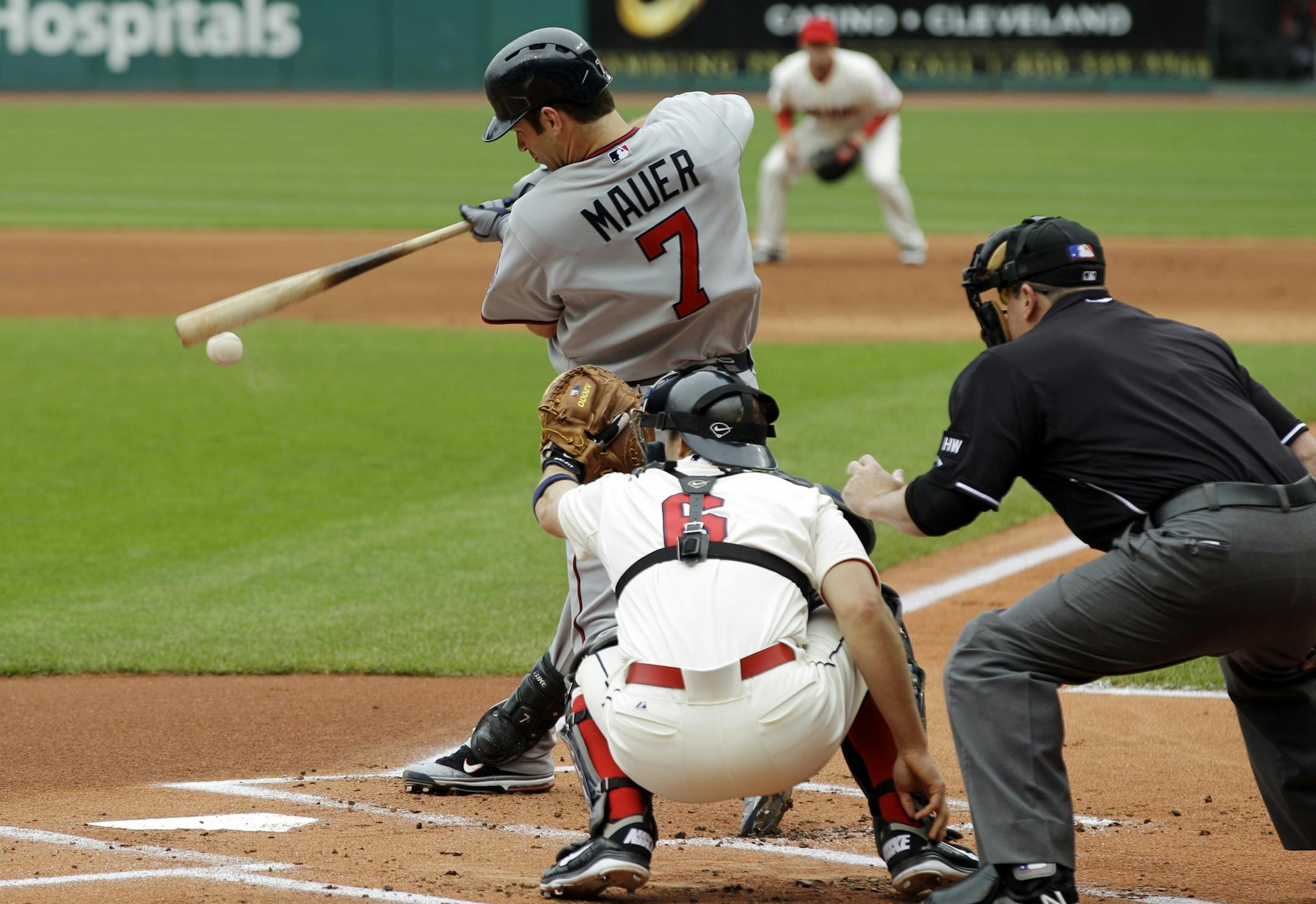 Joe Mauer left Sunday's game, a 6-3 victory at Cleveland, because of a mild sprain of his right thumb but said, 'I'm hoping to get back in there real soon.'