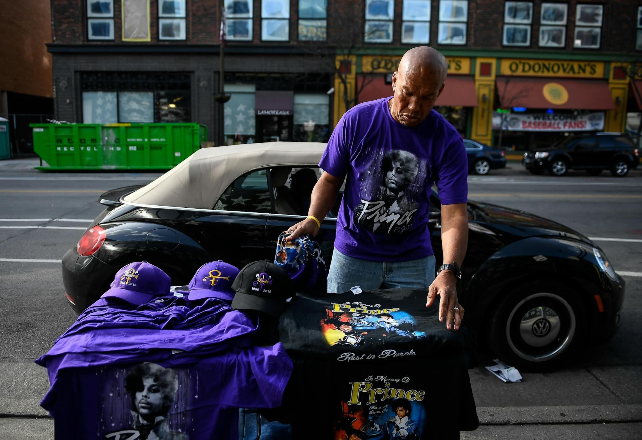 Before being kicked out by First Avenue's management, a vendor named Dee Monser, of Minneapolis, set up a table with Prince apparel for sale outside the venue.