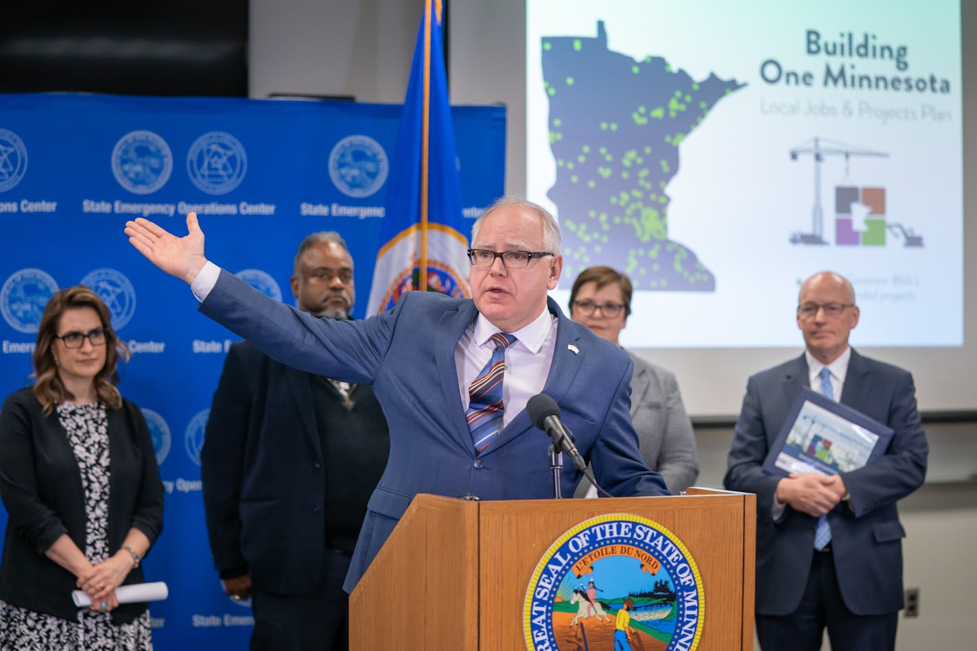 Minnesota Governor Tim Walz unveiled his final bonding packages of $2.028 for his Local Jobs and Projects plan. The announcement was at the Department of Public Safety's Emergency Operations Center, which will be replaced in the package. ] GLEN STUBBE &#x2022; glen.stubbe@startribune.com Wednesday, January 15, 2020 Behind him are Lt. Governor Peggy Flanagan, Public Safety Commissioner John Harrington, Transportation Commissioner Margaret Anderson Kelliher and MMB Commissioner Myron Frans.