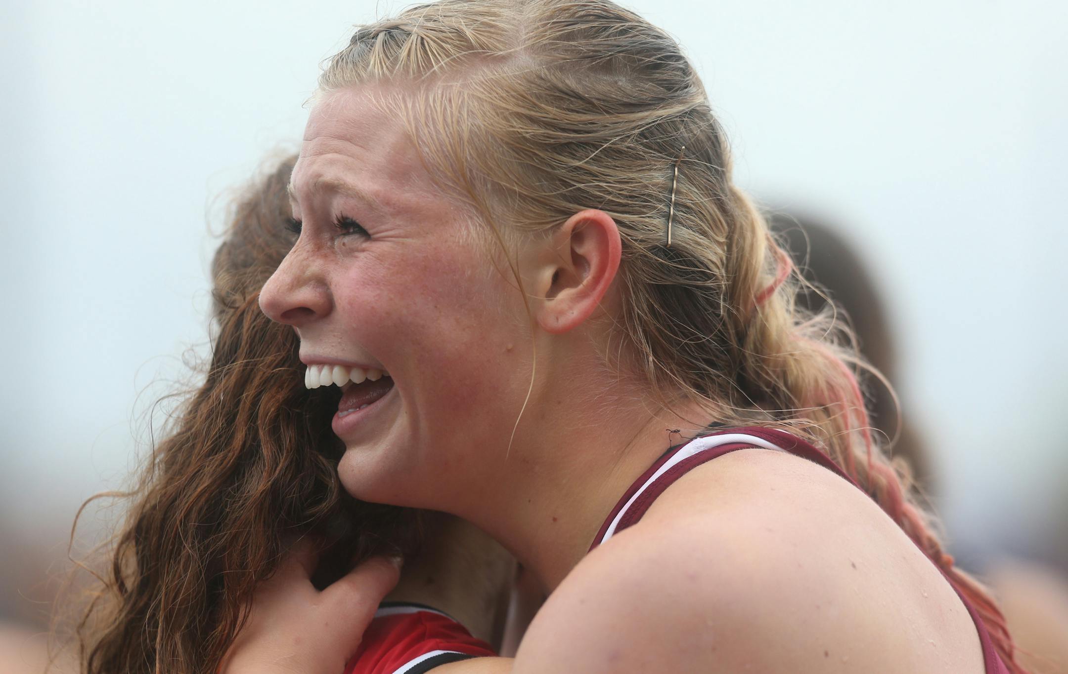 Lakeville South's Shaina Burns celebrated with a fellow hurdler after winning in the 100 meter hurdles. ] (KYNDELL HARKNESS/STAR TRIBUNE) kyndell.harkness@startribune.com During the Class 2A state track and field meet at Hamilne University in St Paul, Min. Saturday, June 7, 2014.