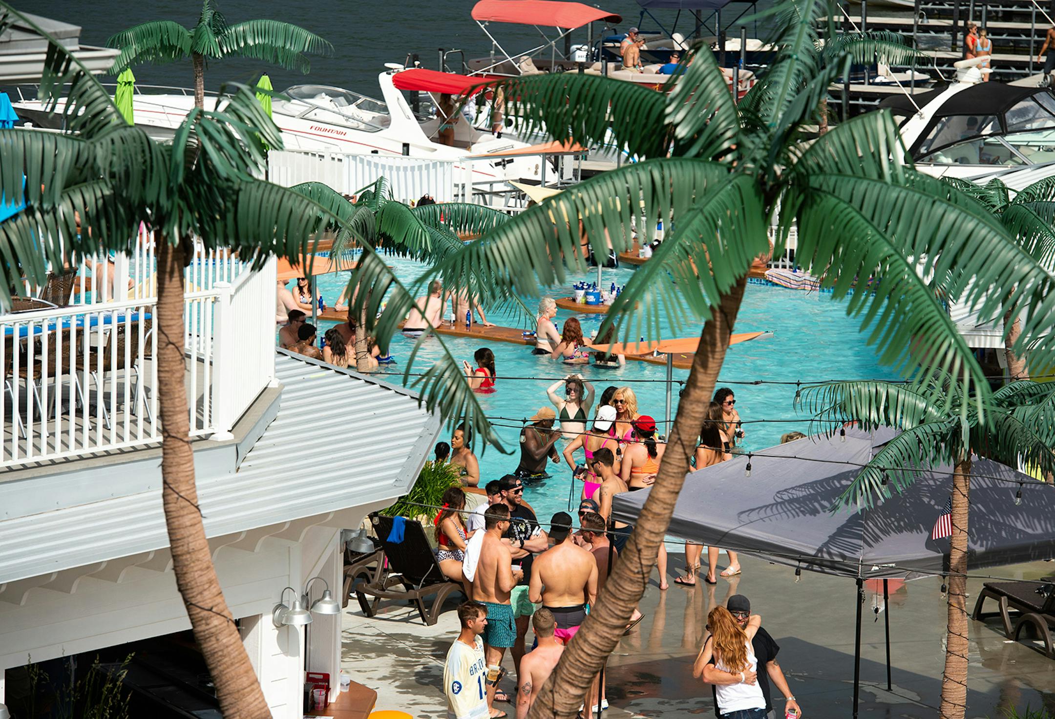 Crowds of people gather at Coconuts Caribbean Beach Bar & Grill in Gravois Mills, Missouri Sunday afternoon, May 24, 2020. Several beach bars along Lake of the Ozarks were packed with party-goers during the Memorial Day weekend. (Shelly Yang/Kansas City Star/TNS) ORG XMIT: 1671959