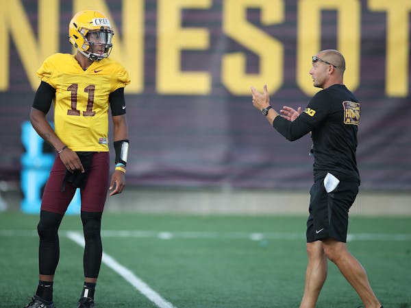 Quarterback Demry Croft took direction from Gophers Head Coach P.J. Fleck during the Gophers football practice at Gibson-Nagurski Football Complex, Fr