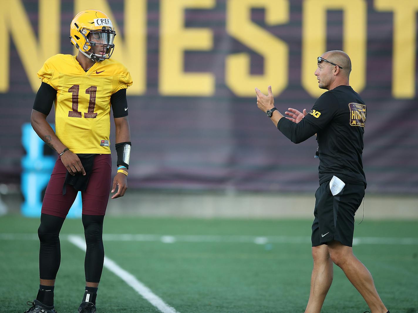 Quarterback Demry Croft took direction from Gophers Head Coach P.J. Fleck during the Gophers football practice at Gibson-Nagurski Football Complex, Friday, August 4, 2017 in Minneapolis, MN. ] ELIZABETH FLORES &#xef; liz.flores@startribune.com