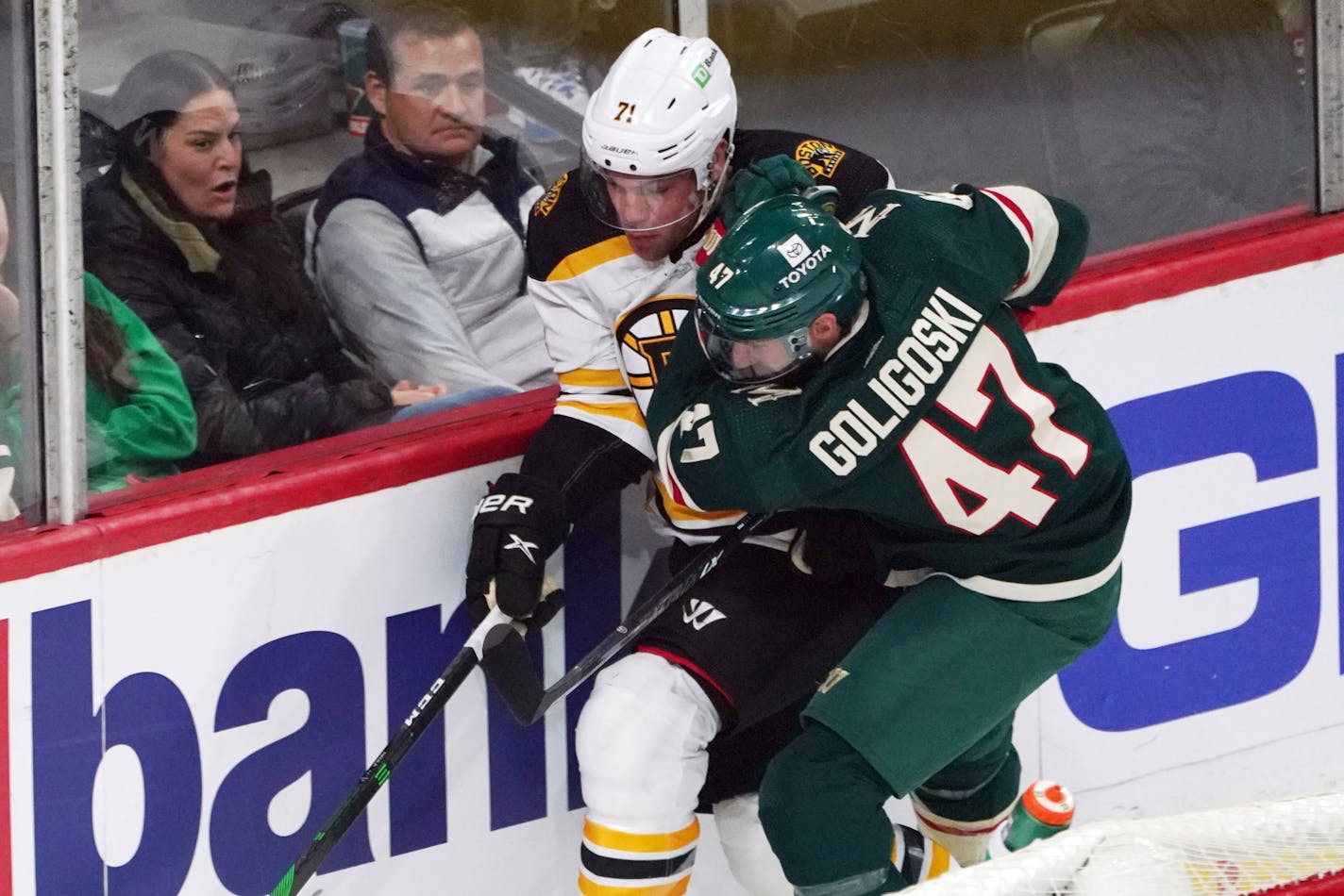 The Wild's Alex Goligoski and Boston's Taylor Hall chase the puck during the first period Wednesday