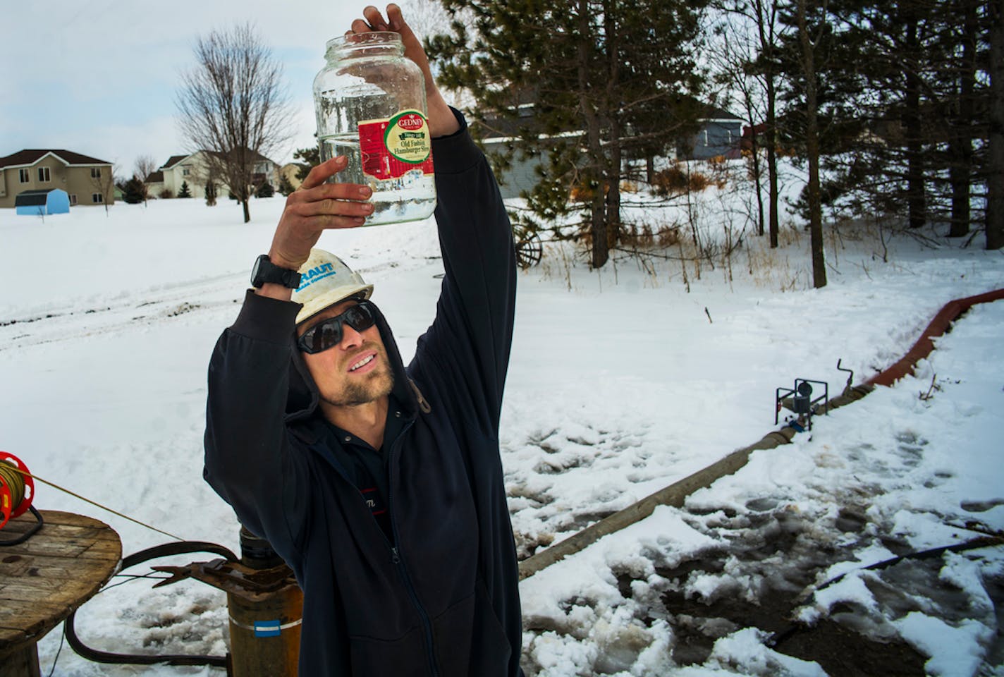 Adam Schellinger, a pump technician for Traut Wells, tested water from a new well. The DNR allowed the town to dig a new well to meet the growing demands of the city of Cold Spring, including Cold Spring Brewery.