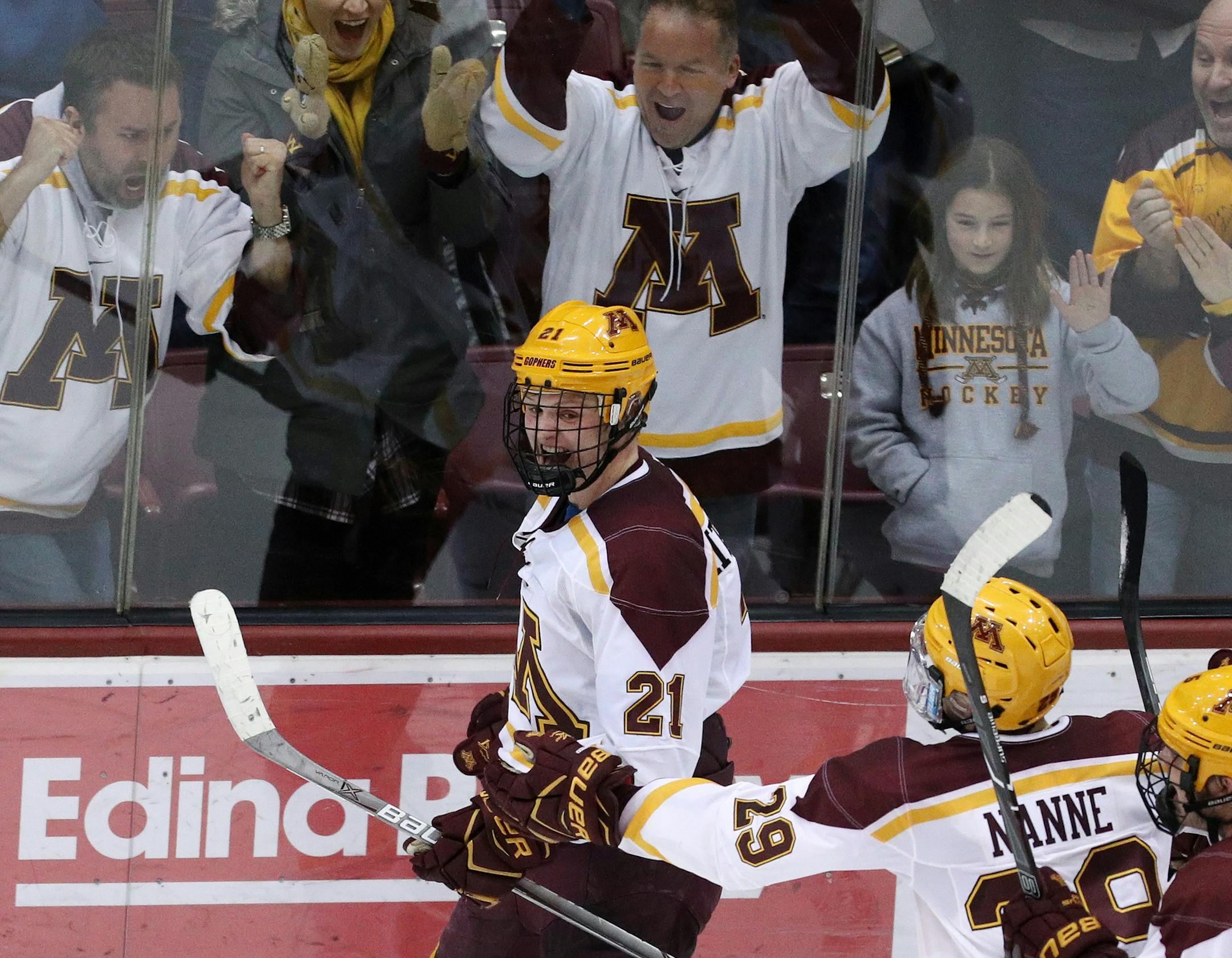 Minnesota Golden Gophers forward Casey Mittelstadt (21) celebrated with his teammates after scoring the game winning goal on Notre Dame Fighting Irish goaltender Cale Morris (32) in overtime. ] ANTHONY SOUFFLE &#xef; anthony.souffle@startribune.com The Minnesota Golden Gophers played the Notre Dame Fighting Irish in an NCAA men's ice hockey game Friday, Jan. 26, 2018 at the 3M Arena at Mariucci in Minneapolis.