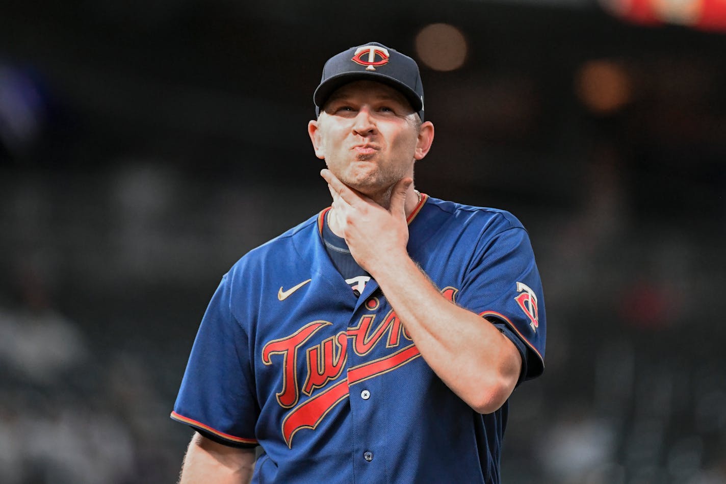 Minnesota Twins pitcher Tyler Duffey walks to the dougout after giving up three runs to the Kansas City Royals during the eighth inning of a baseball game Thursday, May 26, 2022, in Minneapolis. (AP Photo/Craig Lassig)