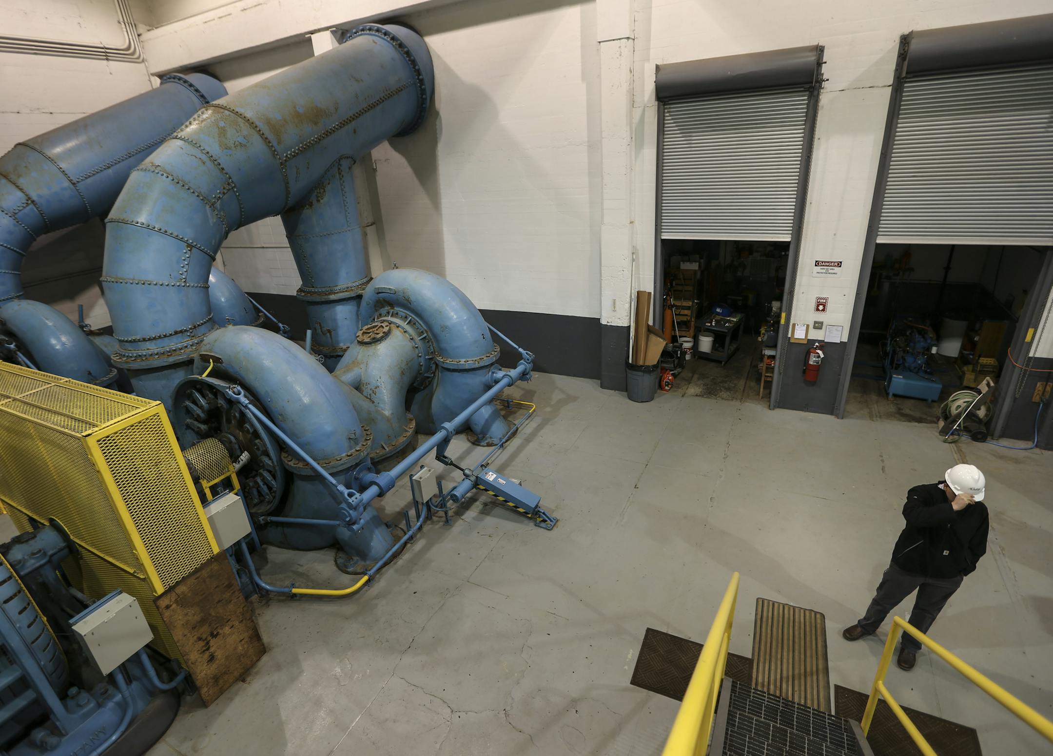 The turbines in the more than 100 year old Byllesby Dam photographed on October 31, 2014 near Cannon Falls, Minn. At right is Dakota County water resources engineer Josh Petersen. ] RENEE JONES SCHNEIDER • reneejones@startribune.com
