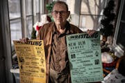 Norm Kietzer with wrestling promotional posters he created.