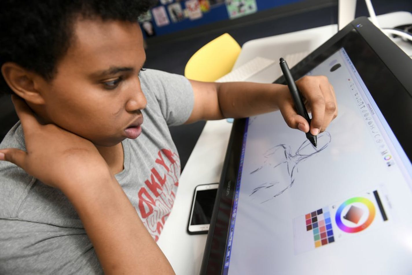 Ahmed Abdul, 18, a recent Minneapolis Southwest graduate, worked on illustrations Thursday on a tablet at Best Buys Teen Tech Center in Minneapolis.