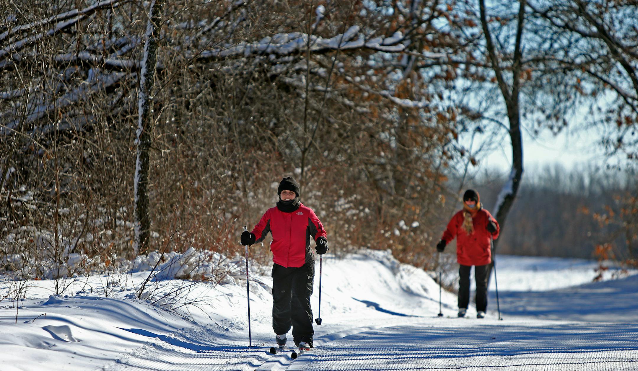 Carrie Lehenbauer, cq, left of St. Paul, and Kay Provine of Lake Elmo, made their way through one of the ski trails at the Nordic Center at Lake Elmo Park Reserve, Tuesday, February 2, 2014. (ELIZABETH FLORES/STAR TRIBUNE) ELIZABETH FLORES &#x2022; eflores@startribune.com
