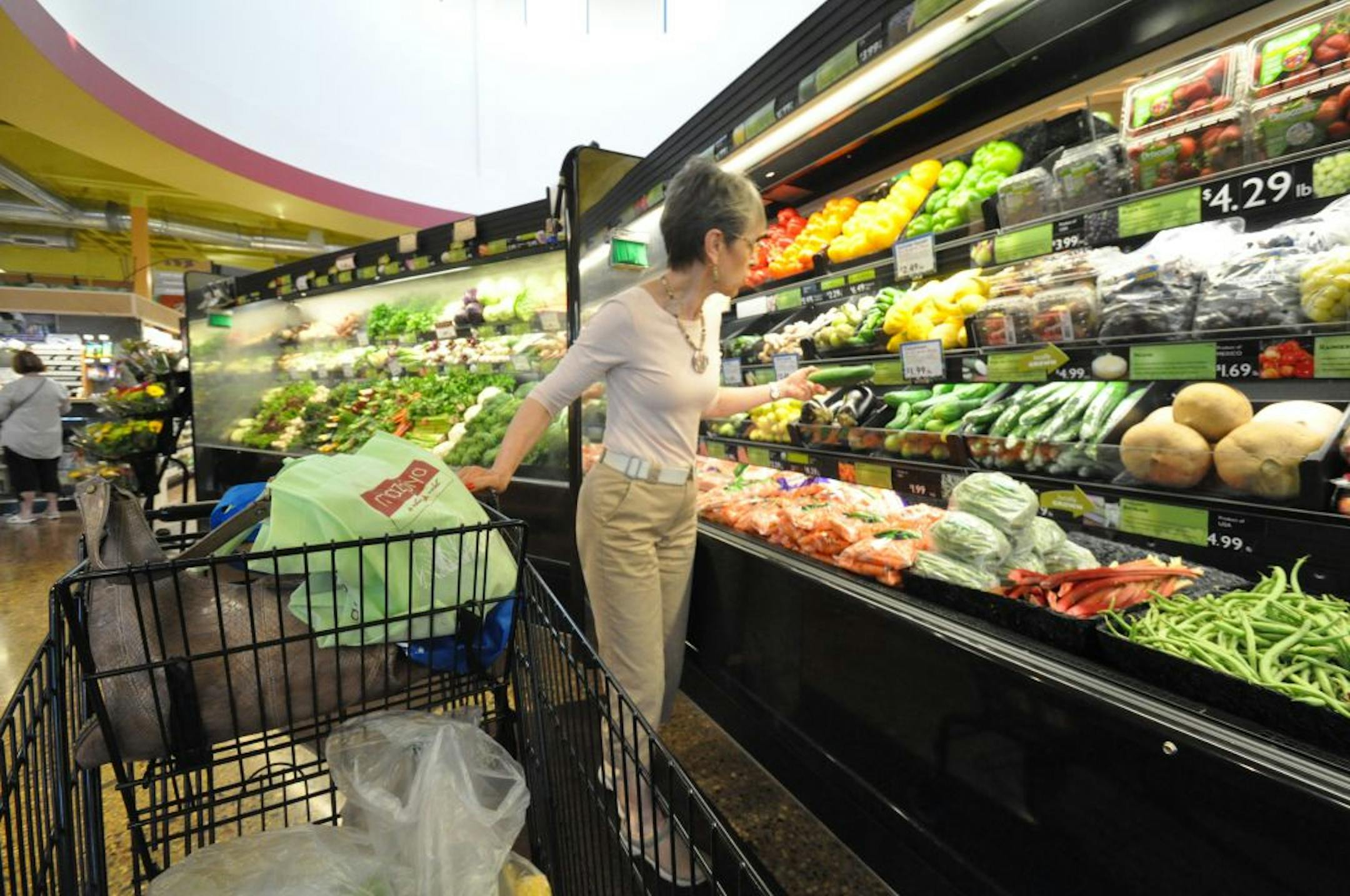 Hope Lindquist of Prior Lake shopped in the produce section of Mazopiya, the Shakopee tribe's natural foods store. She shops at the store several times a week.