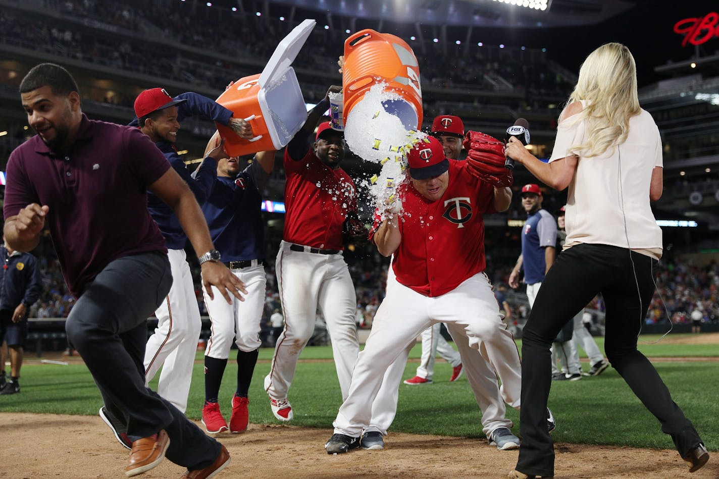 Minnesota Twins starting pitcher Bartolo Colon (40) was drenched with water by his teammates following the game.