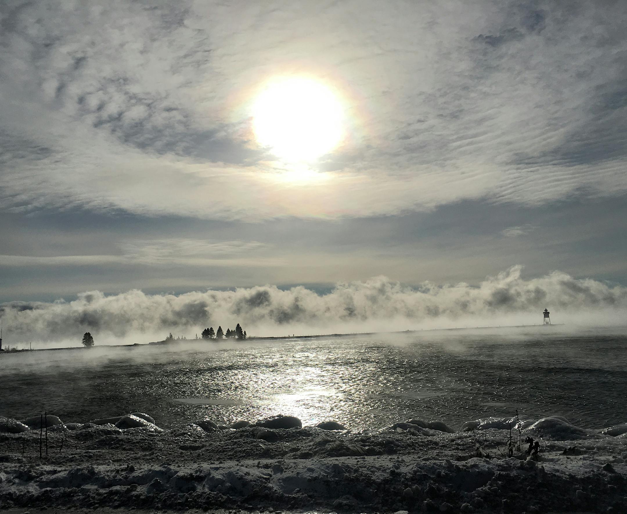 These photos were taken on our 6th annual Christmas-New Years week at Blue Fin Bay Resort in Tofte, Minnesota.
My husband and I always go out hiking on a variety of trails on the North Shore during our stay. Some years have been a bit warmer but this year was a bit more challenging with the colder temperatures. This does not stop us though! We bundle up and head out on the trails! The views of the lake, rivers, falls. and trails are really quite spectacular in winter!! Photo 1: Picture on the Dy