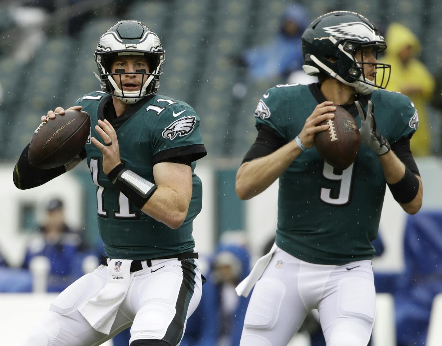 Philadelphia Eagles' Carson Wentz, left, and Nick Foles warm up before an NFL football game against the Indianapolis Colts, Sunday, Sept. 23, 2018, in Philadelphia. (AP Photo/Matt Rourke)