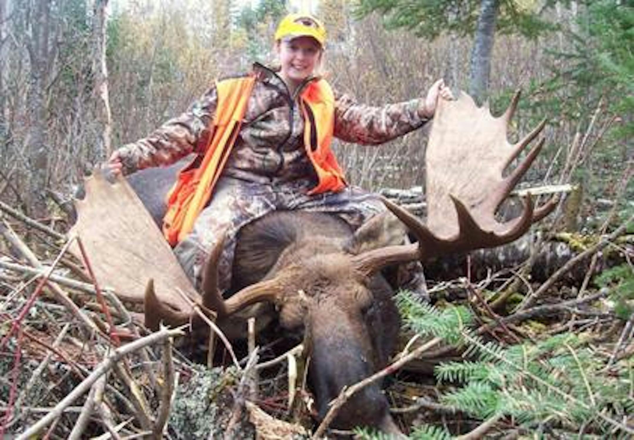 Kelly Holmin and her moose, with a rack that spans 58 inches.