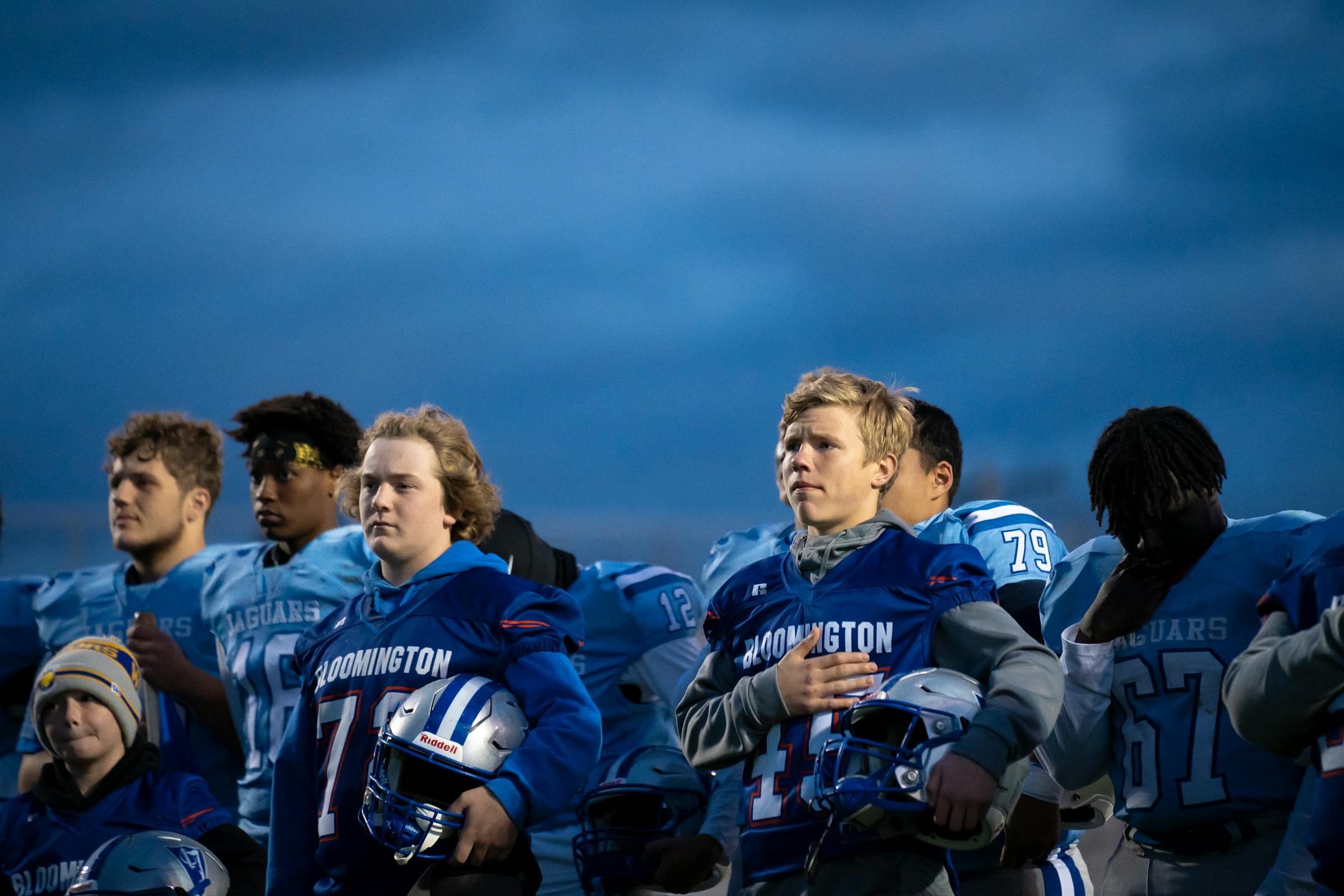 Bloomington Jefferson players stand for the National Anthem before their game against Robbinsdale Cooper Friday night.