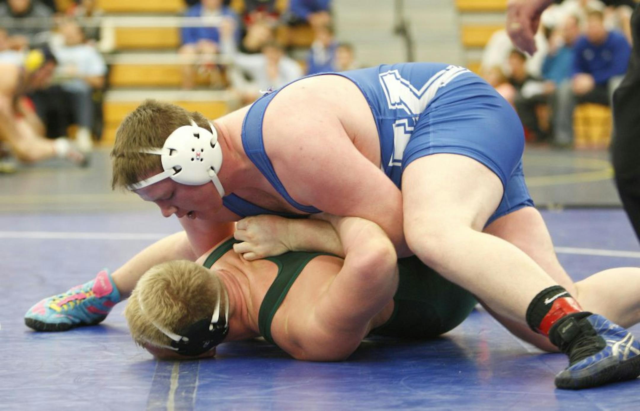Heavyweight Sam Stoll of Kasson-Mantorville turned Mick Nelson of Mounds View during action earlier this year.