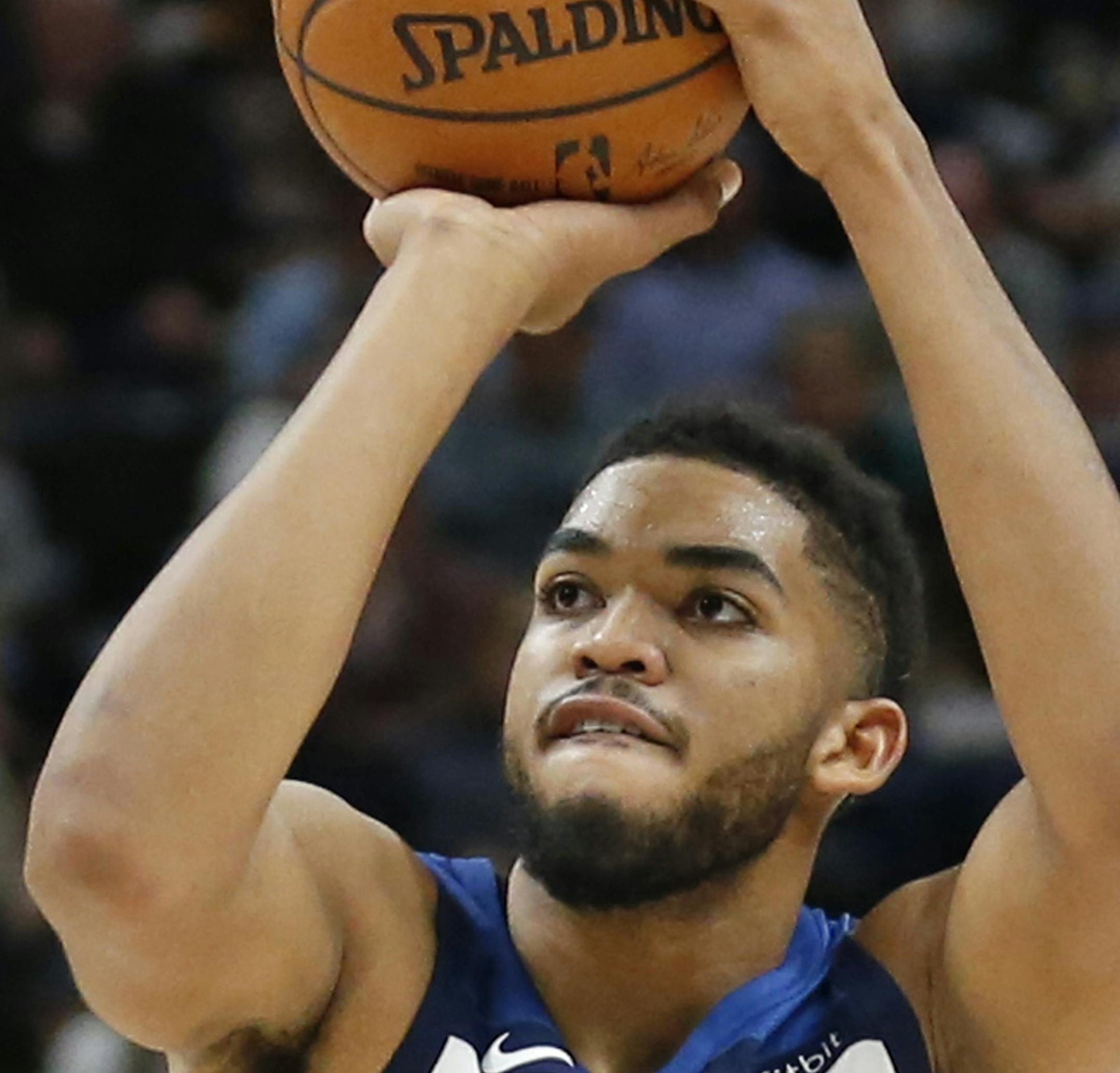 Minnesota Timberwolves center Karl-Anthony Towns (32) hoots against the Utah Jazz in the first half during an NBA basketball game Monday, Nov. 13, 2017, in Salt Lake City. (AP Photo/Rick Bowmer)