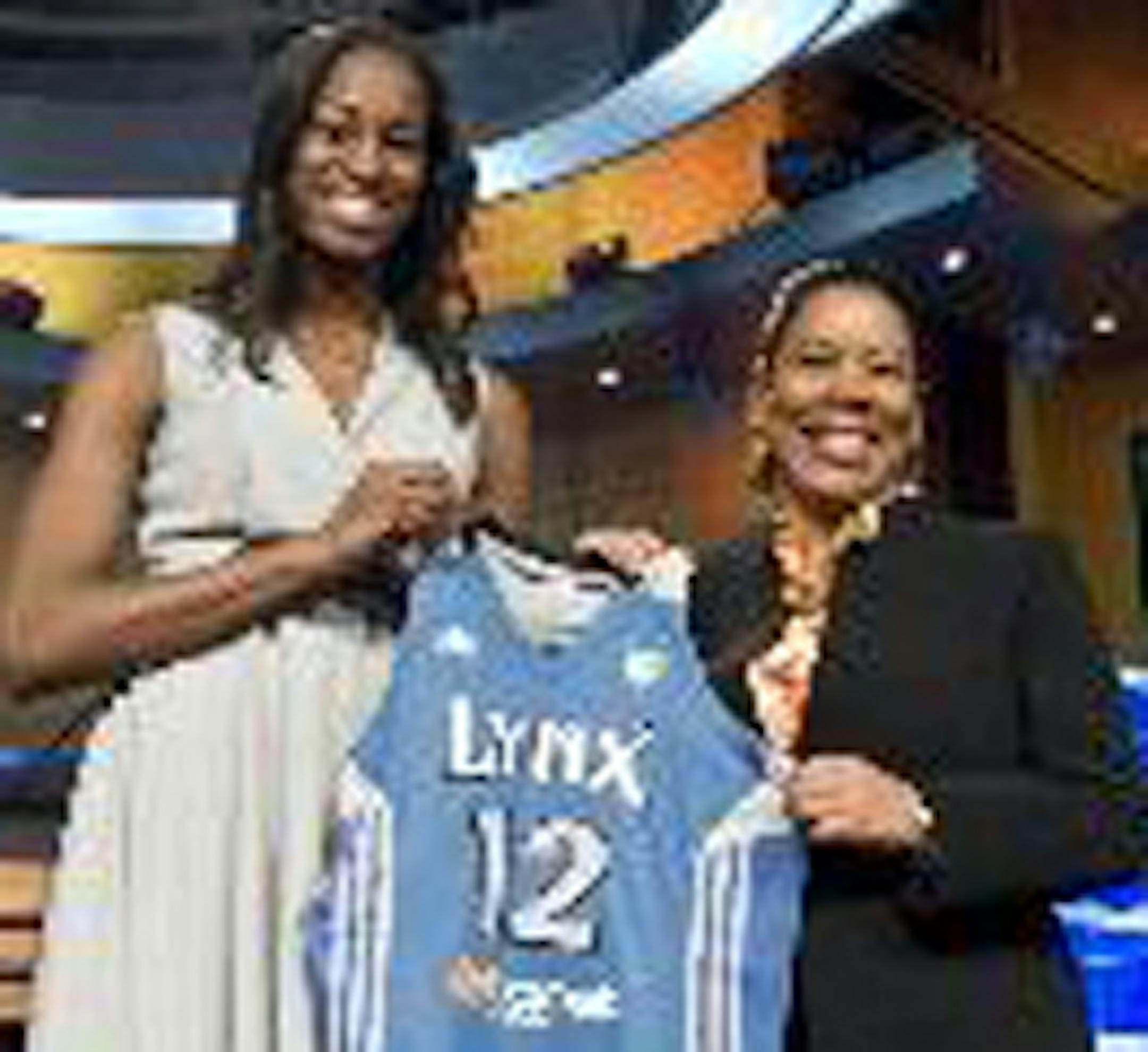 Notre Dame's Devereaux Peters, left, with WNBA President Laurel J. Richie.