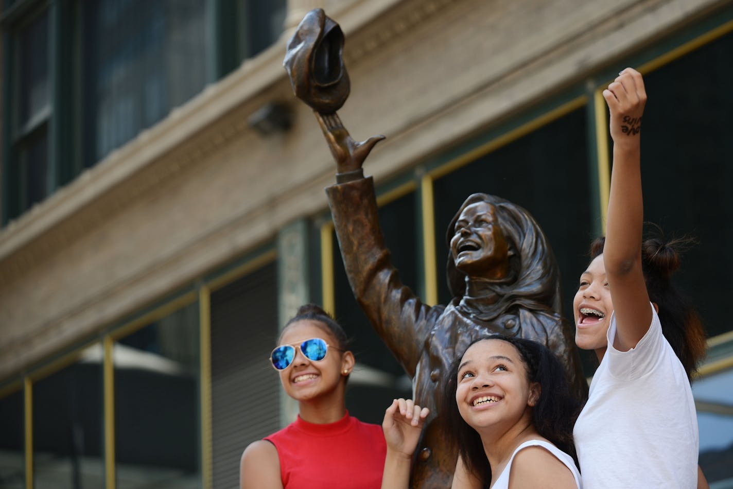 From left, Shanell Carter, Alana Ingram-Diego and Alayna Ap, all of St. Paul, posed for their friend's camera phone on The Mary Tyler Moore statue on Nicollet Mall in Minneapolis in 2015.