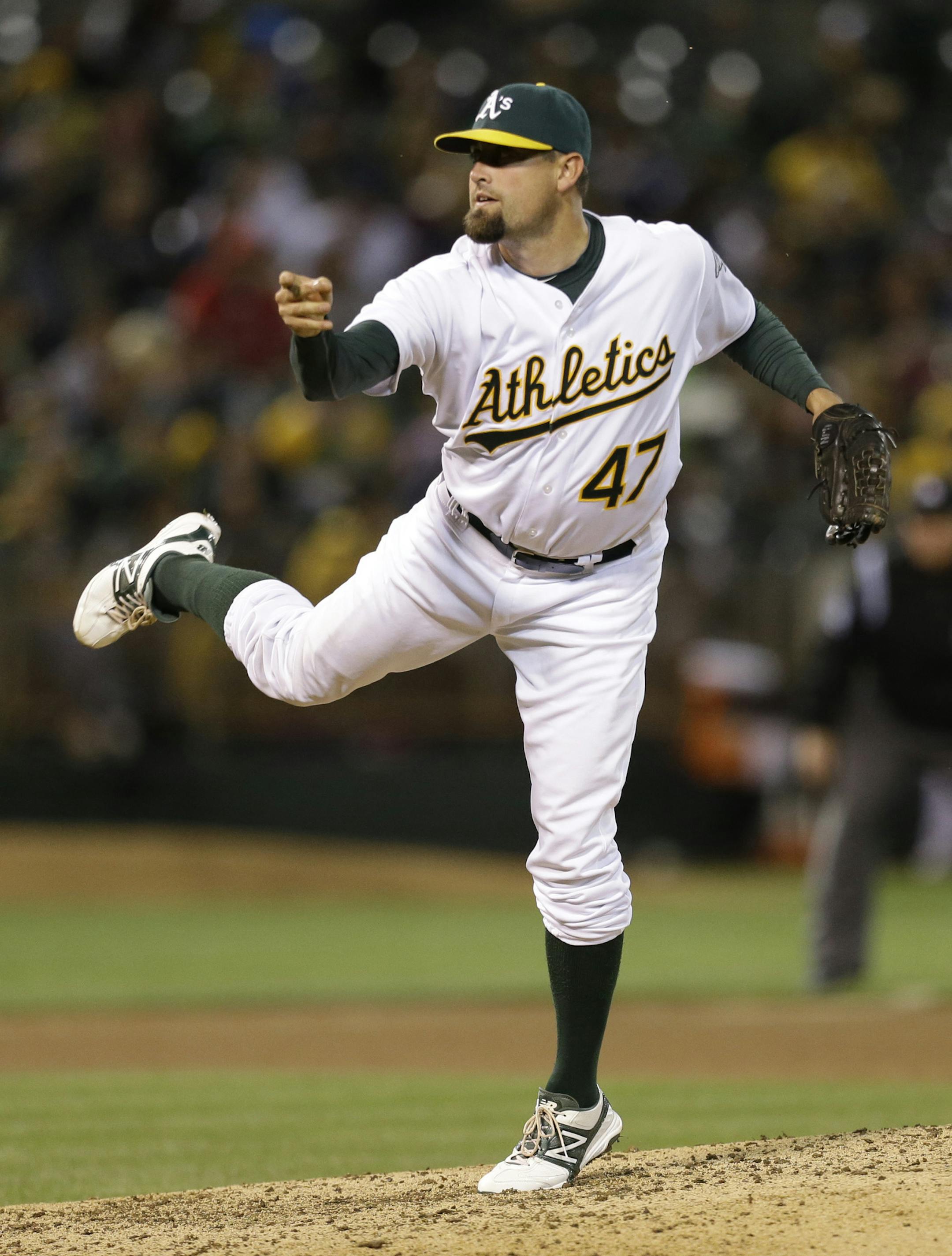 Oakland Athletics' Pat Neshek follows through on a delivery to the Seattle Mariners in the sixth inning of a baseball game Tuesday, April 2, 2013, in Oakland, Calif. (AP Photo/Ben Margot) ORG XMIT: OAS116