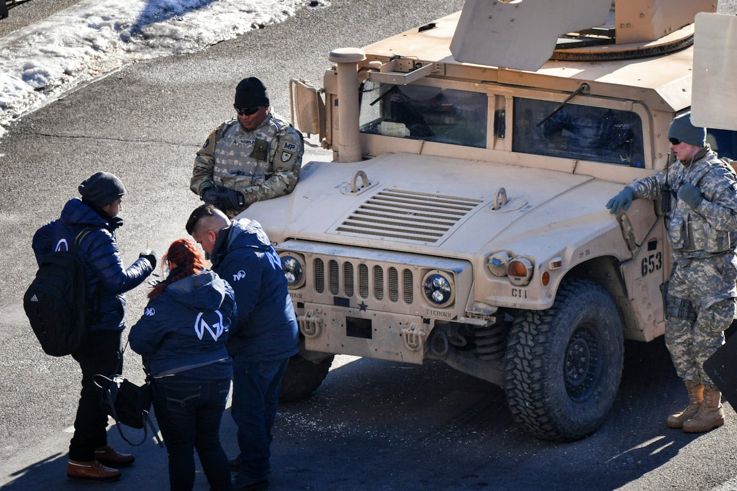 Military police in humvees guard the entrance to the Minneapolis Convention Center.